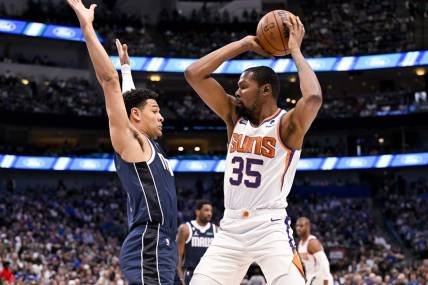 Mar 5, 2023; Dallas, Texas, USA; Phoenix Suns forward Kevin Durant (35) looks to pass the ball around Dallas Mavericks guard Josh Green (8) during the first quarter at the American Airlines Center. Mandatory Credit: Jerome Miron-USA TODAY Sports
