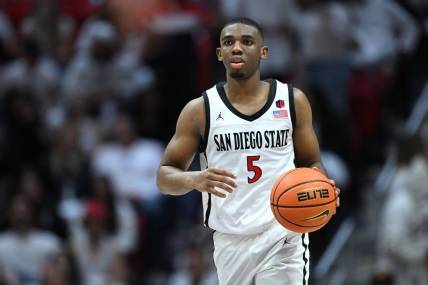 Mar 4, 2023; San Diego, California, USA; San Diego State Aztecs guard Lamont Butler (5) dribbles the ball during the second half against the Wyoming Cowboys at Viejas Arena. Mandatory Credit: Orlando Ramirez-USA TODAY Sports