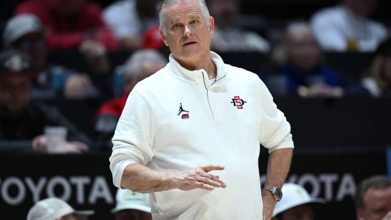 Mar 4, 2023; San Diego, California, USA; San Diego State Aztecs head coach Brian Dutcher looks on during the second half against the Wyoming Cowboys at Viejas Arena. Mandatory Credit: Orlando Ramirez-USA TODAY Sports