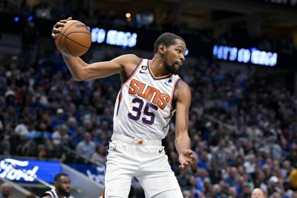 Mar 5, 2023; Dallas, Texas, USA; Phoenix Suns forward Kevin Durant (35) grabs a rebound against the Dallas Mavericks during the second half at the American Airlines Center. Mandatory Credit: Jerome Miron-USA TODAY Sports