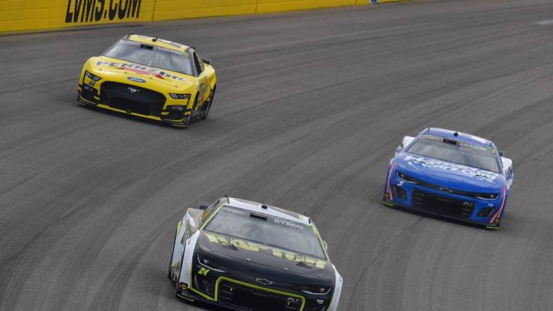 Mar 5, 2023; Las Vegas, Nevada, USA; NASCAR Cup Series driver William Byron (24) leads driver Joey Logano (22) and driver Kyle Larson (5) during the Pennzoil 400 at Las Vegas Motor Speedway. Mandatory Credit: Gary A. Vasquez-USA TODAY Sports