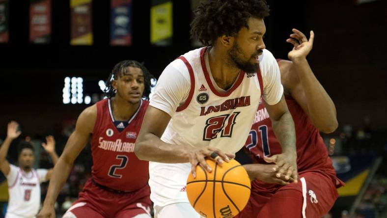 Louisiana's Jordan Brown (No. 21) takes it to the board during Monday's SBC Men's Championship game at the Pensacola Bay Center.

Sbc Men S Basketball Usa Vs Louisiana