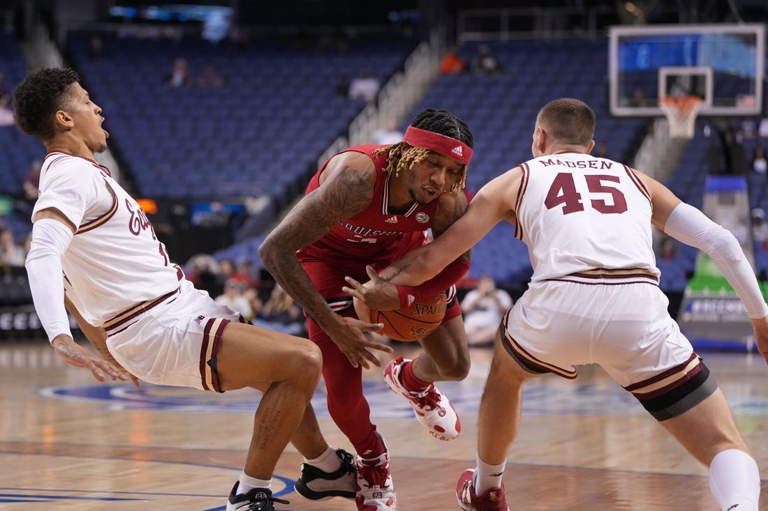 Mar 7, 2023; Greensboro, NC, USA; Louisville Cardinals guard El Ellis (3) with the ball as Boston College Eagles guard Makai Ashton-Langford (11) and guard Mason Madsen (45) defend in the first half of the first round of the ACC Tournament at Greensboro Coliseum. Mandatory Credit: Bob Donnan-USA TODAY Sports