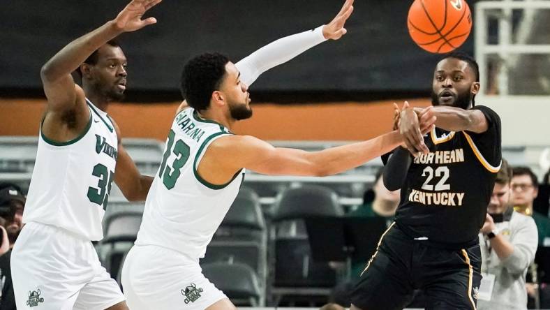 Mar 7, 2023; Indianapolis, IN, USA;  Northern Kentucky Norse guard Trevon Faulkner (22) passes the ball around Cleveland State Vikings forward Tristan Enaruna (13) during the first half at Indiana Farmers Coliseum. Mandatory Credit: Robert Goddin-USA TODAY Sports