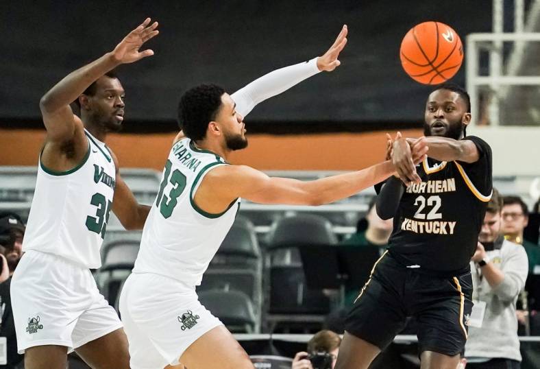Mar 7, 2023; Indianapolis, IN, USA;  Northern Kentucky Norse guard Trevon Faulkner (22) passes the ball around Cleveland State Vikings forward Tristan Enaruna (13) during the first half at Indiana Farmers Coliseum. Mandatory Credit: Robert Goddin-USA TODAY Sports