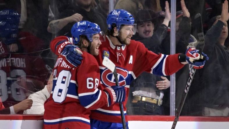 Mar 7, 2023; Montreal, Quebec, CAN; Montreal Canadiens forward Mike Hoffman (68) celebrates with teammate forward Josh Anderson (17) after scoring a goal against the Carolina Hurricanes during the first period at the Bell Centre. Mandatory Credit: Eric Bolte-USA TODAY Sports