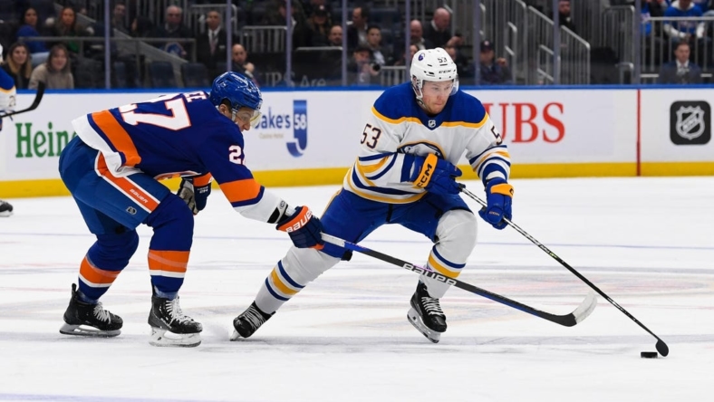 Mar 7, 2023; Elmont, New York, USA;  Buffalo Sabres left wing Jeff Skinner (53) skates with the puck defended by New York Islanders left wing Anders Lee (27) during the first period at UBS Arena. Mandatory Credit: Dennis Schneidler-USA TODAY Sports
