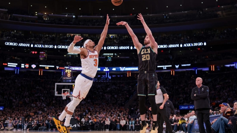 Mar 7, 2023; New York, New York, USA; Charlotte Hornets forward Gordon Hayward (20) shoots the ball against the New York Knicks against New York Knicks guard Josh Hart (3) during the first half at Madison Square Garden. Mandatory Credit: Vincent Carchietta-USA TODAY Sports