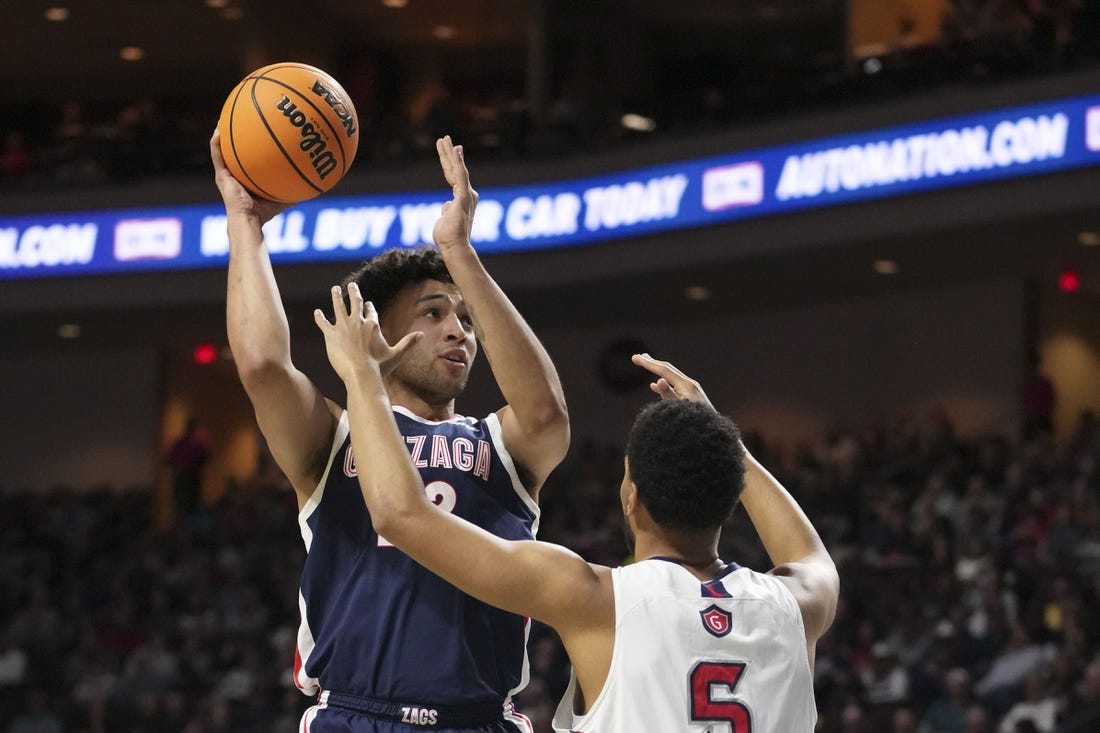 March 7, 2023; Las Vegas, NV, USA; Gonzaga Bulldogs forward Anton Watson (22) shoots the basketball against Saint Mary's Gaels forward Josh Jefferson (5) during the first half in the finals of the WCC Basketball Championships at Orleans Arena. Mandatory Credit: Kyle Terada-USA TODAY Sports