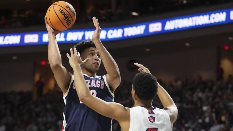 March 7, 2023; Las Vegas, NV, USA; Gonzaga Bulldogs forward Anton Watson (22) shoots the basketball against Saint Mary's Gaels forward Josh Jefferson (5) during the first half in the finals of the WCC Basketball Championships at Orleans Arena. Mandatory Credit: Kyle Terada-USA TODAY Sports