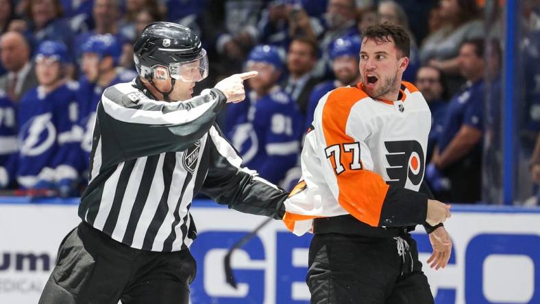 Mar 7, 2023; Tampa, Florida, USA;  Philadelphia Flyers defenseman Tony DeAngelo (77) reacts after a penalty during a game against the Tampa Bay Lightning in the third period at Amalie Arena. Mandatory Credit: Nathan Ray Seebeck-USA TODAY Sports