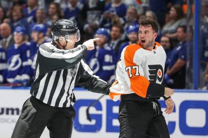 Mar 7, 2023; Tampa, Florida, USA;  Philadelphia Flyers defenseman Tony DeAngelo (77) reacts after a penalty during a game against the Tampa Bay Lightning in the third period at Amalie Arena. Mandatory Credit: Nathan Ray Seebeck-USA TODAY Sports