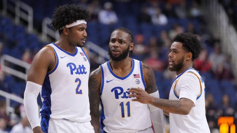 Mar 8, 2023; Greensboro, NC, USA; Pittsburgh Panthers forward Blake Hinson (2) and Pittsburgh Panthers guard Jamarius Burton (11) and Pittsburgh Panthers guard Nelly Cummings (0) huddle in the second half of the second round at Greensboro Coliseum. Mandatory Credit: Bob Donnan-USA TODAY Sports