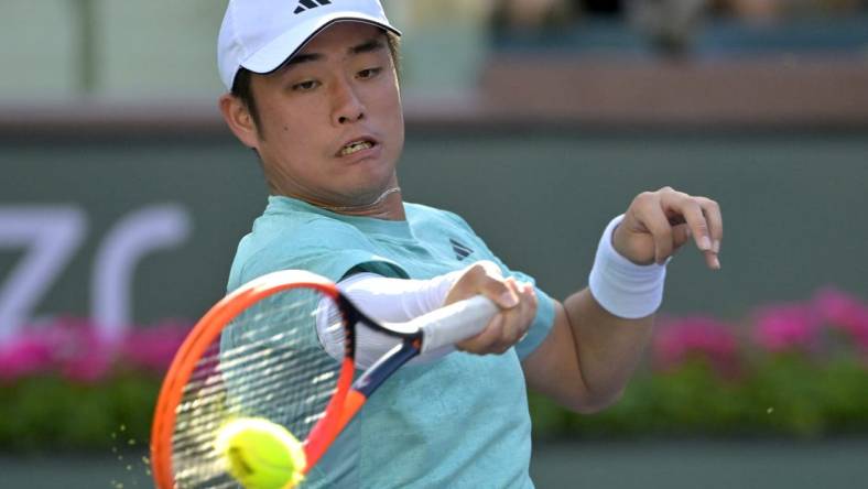 Mar 8, 2023; Indian Wells, CA, USA;  Yibing Wu (CHN) hits a shot during his first round match against Jaume Munar (not pictured) at the BNP Paribas Open at the Indian Well Tennis Garden. Mandatory Credit: Jayne Kamin-Oncea-USA TODAY Sports