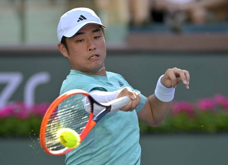 Mar 8, 2023; Indian Wells, CA, USA;  Yibing Wu (CHN) hits a shot during his first round match against Jaume Munar (not pictured) at the BNP Paribas Open at the Indian Well Tennis Garden. Mandatory Credit: Jayne Kamin-Oncea-USA TODAY Sports