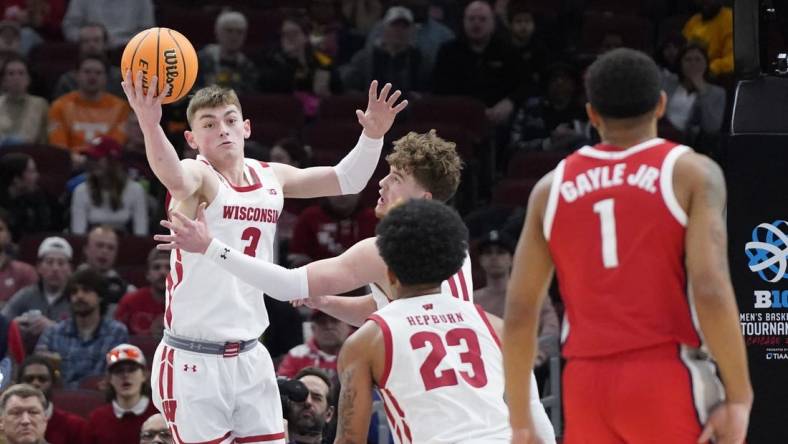 Mar 8, 2023; Chicago, IL, USA; Wisconsin Badgers guard Connor Essegian (3) grabs a rebound against the Ohio State Buckeyes during the first half at United Center. Mandatory Credit: David Banks-USA TODAY Sports