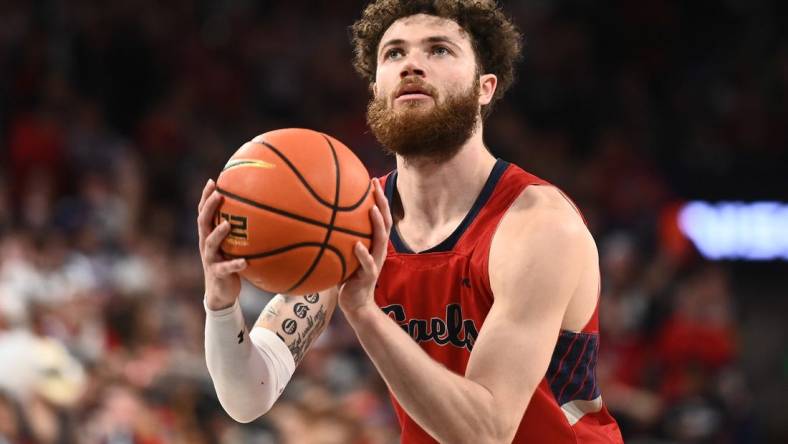 Feb 25, 2023; Spokane, Washington, USA; St. Mary's Gaels guard Logan Johnson (0) shoots the ball against the Gonzaga Bulldogs in the second half at McCarthey Athletic Center. Mandatory Credit: James Snook-USA TODAY Sports