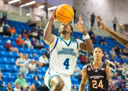 Mar 8, 2023; Lake Charles, LA, USA; Texas A&M-Corpus Christi Islanders guard Jalen Jackson (4) drives to the basket against the Northwestern State Demons during the Southland Basketball Championships at the Legacy Center. Mandatory Credit: Scott Clause-USA TODAY Sports