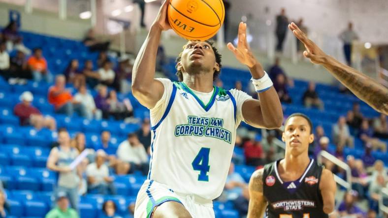 Mar 8, 2023; Lake Charles, LA, USA; Texas A&M-Corpus Christi Islanders guard Jalen Jackson (4) drives to the basket against the Northwestern State Demons during the Southland Basketball Championships at the Legacy Center. Mandatory Credit: Scott Clause-USA TODAY Sports