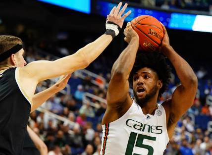 Mar 9, 2023; Greensboro, NC, USA; Miami (Fl) Hurricanes forward Norchad Omier (15) moves the ball into the lane against the Wake Forest Demon Deacons during the first half of the quarterfinals of the ACC tournament at Greensboro Coliseum. Mandatory Credit: John David Mercer-USA TODAY Sports