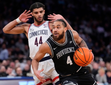 Mar 9, 2023; New York, NY, USA;  Providence Friars guard Jared Bynum (4) drives on Connecticut Huskies guard Andre Jackson Jr. (44) in the second half at Madison Square Garden. Mandatory Credit: Robert Deutsch-USA TODAY Sports