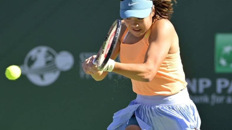 Mar 9, 2023; Indian Wells, CA, USA;  Emma Raducanu (GBR) hits a shot in her first round match against Danka Kovinic (not pictured) on day 4 of the BNP Paribas Open at the Indian Wells Tennis Garden. Mandatory Credit: Jayne Kamin-Oncea-USA TODAY Sports