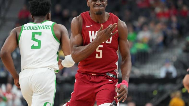 Mar 9, 2023; Las Vegas, NV, USA; Washington State Cougars guard TJ Bamba (5) reacts after a scoring play against the Oregon Ducks during the second half at T-Mobile Arena. Mandatory Credit: Stephen R. Sylvanie-USA TODAY Sports