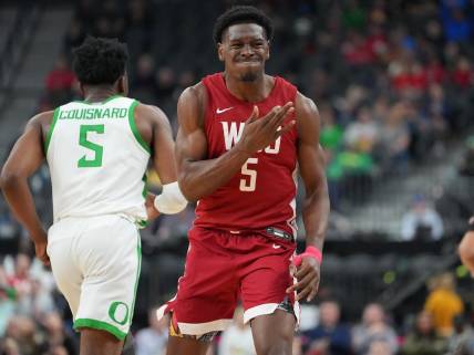 Mar 9, 2023; Las Vegas, NV, USA; Washington State Cougars guard TJ Bamba (5) reacts after a scoring play against the Oregon Ducks during the second half at T-Mobile Arena. Mandatory Credit: Stephen R. Sylvanie-USA TODAY Sports