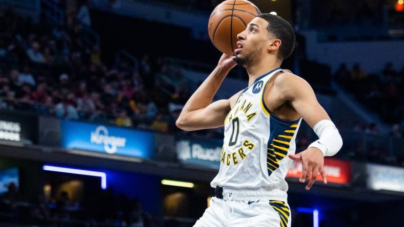 Mar 9, 2023; Indianapolis, Indiana, USA; Indiana Pacers guard Tyrese Haliburton (0) shoots the ball in the first quarter against the Houston Rockets at Gainbridge Fieldhouse. Mandatory Credit: Trevor Ruszkowski-USA TODAY Sports