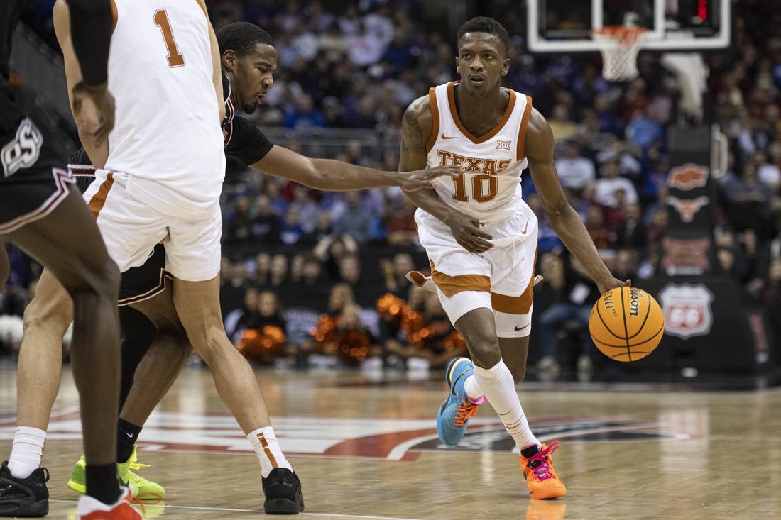 Mar 9, 2023; Kansas City, MO, USA; Texas Longhorns guard Sir'Jabari Rice (10) handles the ball against the Oklahoma State Cowboys in the second half at T-Mobile Center. Mandatory Credit: Amy Kontras-USA TODAY Sports