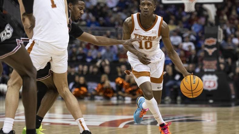 Mar 9, 2023; Kansas City, MO, USA; Texas Longhorns guard Sir'Jabari Rice (10) handles the ball against the Oklahoma State Cowboys in the second half at T-Mobile Center. Mandatory Credit: Amy Kontras-USA TODAY Sports