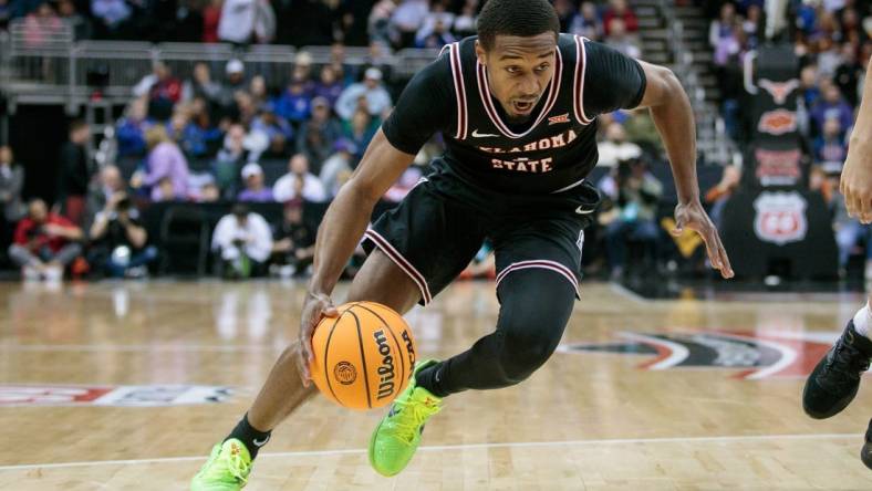 Mar 9, 2023; Kansas City, MO, USA; Oklahoma State Cowboys guard Bryce Thompson (1) drives to the basket during the second half against the Texas Longhorns at T-Mobile Center. Mandatory Credit: William Purnell-USA TODAY Sports