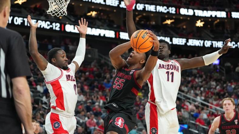 Mar 9, 2023; Las Vegas, NV, USA; Stanford Cardinal forward Harrison Ingram (55) attempts to shoot between Arizona Wildcats guard Courtney Ramey (0) and center Oumar Ballo (11) during the first half at T-Mobile Arena. Mandatory Credit: Stephen R. Sylvanie-USA TODAY Sports