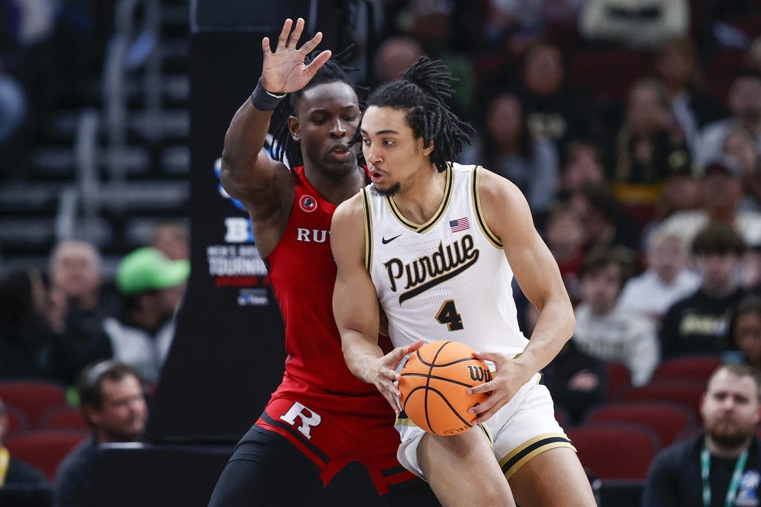 Mar 10, 2023; Chicago, IL, USA; Rutgers Scarlet Knights center Clifford Omoruyi (11) defends against Purdue Boilermakers forward Trey Kaufman-Renn (4) during the first half at United Center. Mandatory Credit: Kamil Krzaczynski-USA TODAY Sports