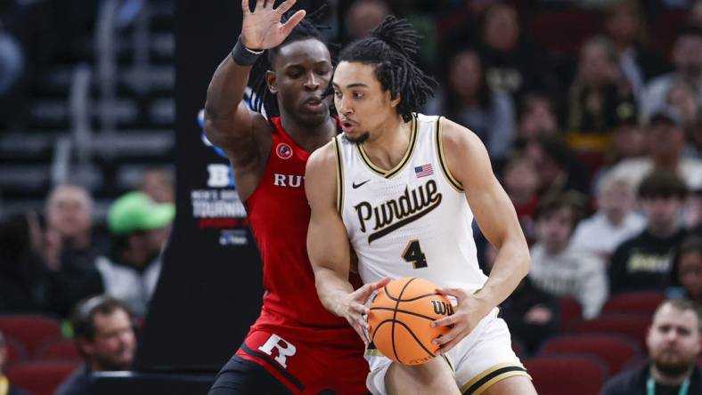 Mar 10, 2023; Chicago, IL, USA; Rutgers Scarlet Knights center Clifford Omoruyi (11) defends against Purdue Boilermakers forward Trey Kaufman-Renn (4) during the first half at United Center. Mandatory Credit: Kamil Krzaczynski-USA TODAY Sports