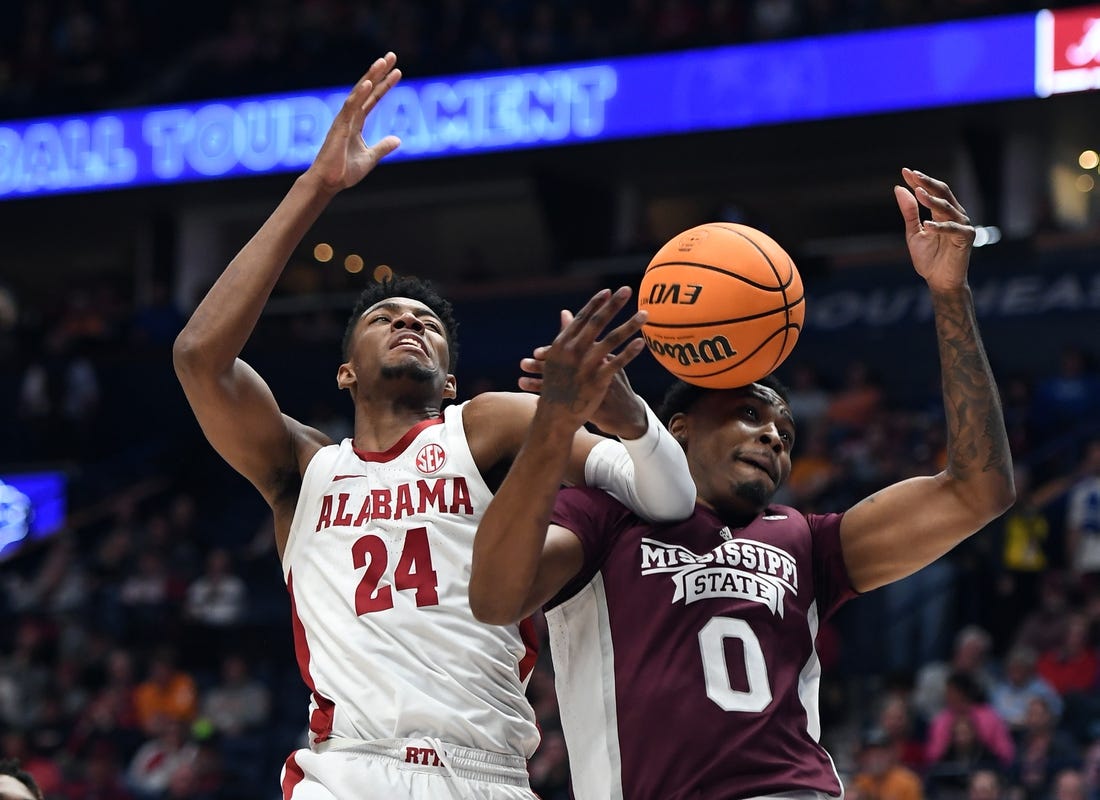 Mar 10, 2023; Nashville, TN, USA; Alabama Crimson Tide forward Brandon Miller (24) battles with Mississippi State Bulldogs forward D.J. Jeffries (0) for a rebound during the first half at Bridgestone Arena. Mandatory Credit: Christopher Hanewinckel-USA TODAY Sports