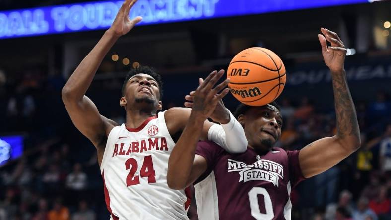 Mar 10, 2023; Nashville, TN, USA; Alabama Crimson Tide forward Brandon Miller (24) battles with Mississippi State Bulldogs forward D.J. Jeffries (0) for a rebound during the first half at Bridgestone Arena. Mandatory Credit: Christopher Hanewinckel-USA TODAY Sports