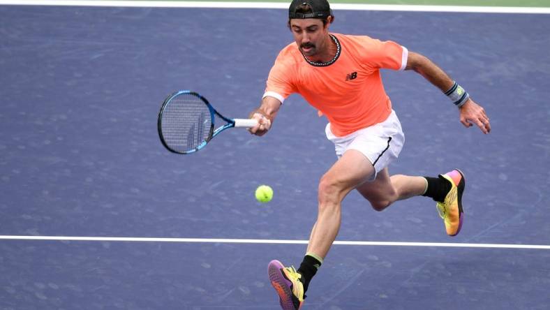 Mar 10, 2023; Indian Wells, CA, USA; Jordan Thompson (AUS) hits a forehand approach shot during his 2nd round match against Stefanos Tsitsipas (GRE) (not pictured) during the BNP Paribas Open at Indian Wells Tennis Garden. Mandatory Credit: Jonathan Hui-USA TODAY Sports