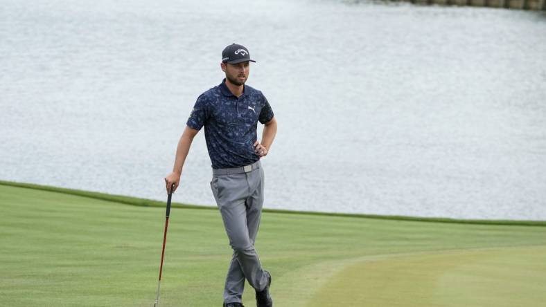 Mar 10, 2023; Ponte Vedra Beach, Florida, USA; Adam Svensson waits on the 18th green during the second round of THE PLAYERS Championship golf tournament. Mandatory Credit: David Yeazell-USA TODAY Sports