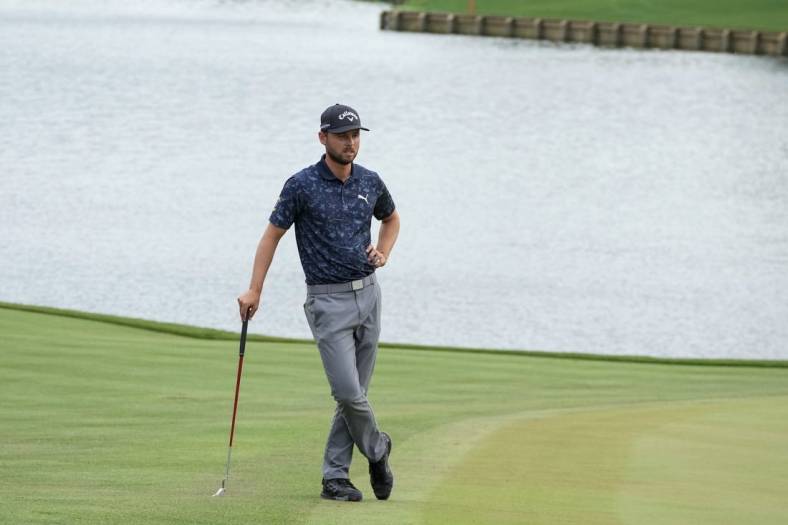 Mar 10, 2023; Ponte Vedra Beach, Florida, USA; Adam Svensson waits on the 18th green during the second round of THE PLAYERS Championship golf tournament. Mandatory Credit: David Yeazell-USA TODAY Sports