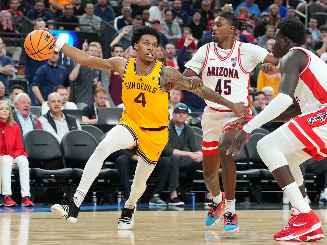 Mar 10, 2023; Las Vegas, NV, USA; Arizona State Sun Devils guard Desmond Cambridge Jr. (4) dribbles against Arizona Wildcats guard Cedric Henderson Jr. (45) during the first half at T-Mobile Arena. Mandatory Credit: Stephen R. Sylvanie-USA TODAY Sports