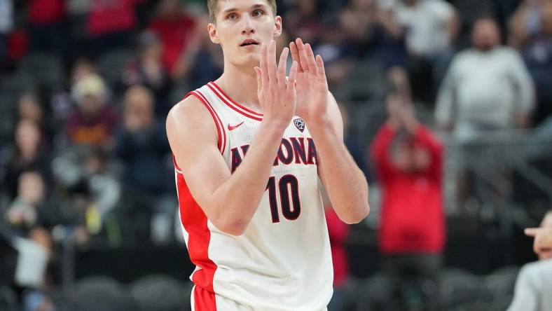 Mar 10, 2023; Las Vegas, NV, USA; Arizona Wildcats forward Azuolas Tubelis (10) applauds after the Wildcats defeated the Arizona State Sun Devils 78-59 at T-Mobile Arena. Mandatory Credit: Stephen R. Sylvanie-USA TODAY Sports