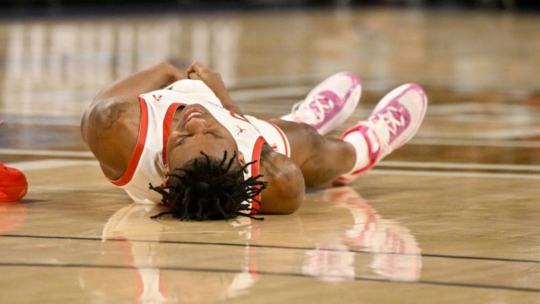 Mar 11, 2023; Fort Worth, TX, USA; Houston Cougars guard Marcus Sasser (0) is injured during the first half against the Cincinnati Bearcats at Dickies Arena. Mandatory Credit: Jerome Miron-USA TODAY Sports