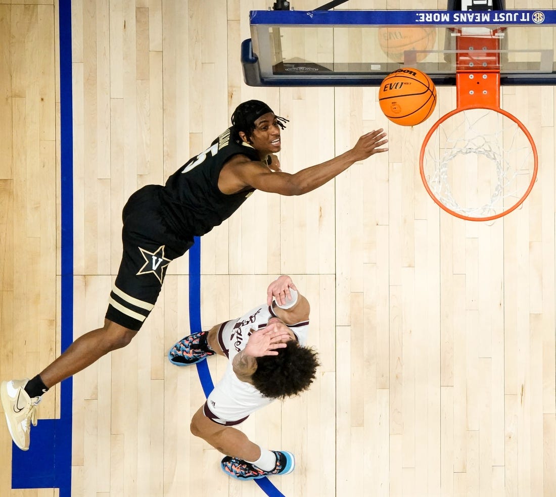 Vanderbilt guard Ezra Manjon (5) shoots over Texas A&M forward Andersson Garcia (11) during the second half of a SEC Men   s Basketball Tournament semifinal game at Bridgestone Arena in Nashville, Tenn., Saturday, March 11, 2023.

Vandy Tam Sec 031123 An 009