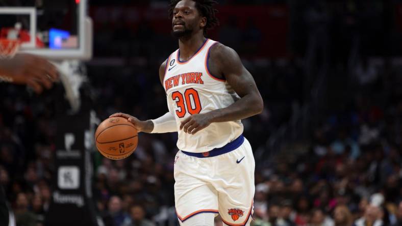 Mar 11, 2023; Los Angeles, California, USA;  New York Knicks forward Julius Randle (30) brings the ball up court during the third quarter against the Los Angeles Clippers at Crypto.com Arena. Mandatory Credit: Kiyoshi Mio-USA TODAY Sports