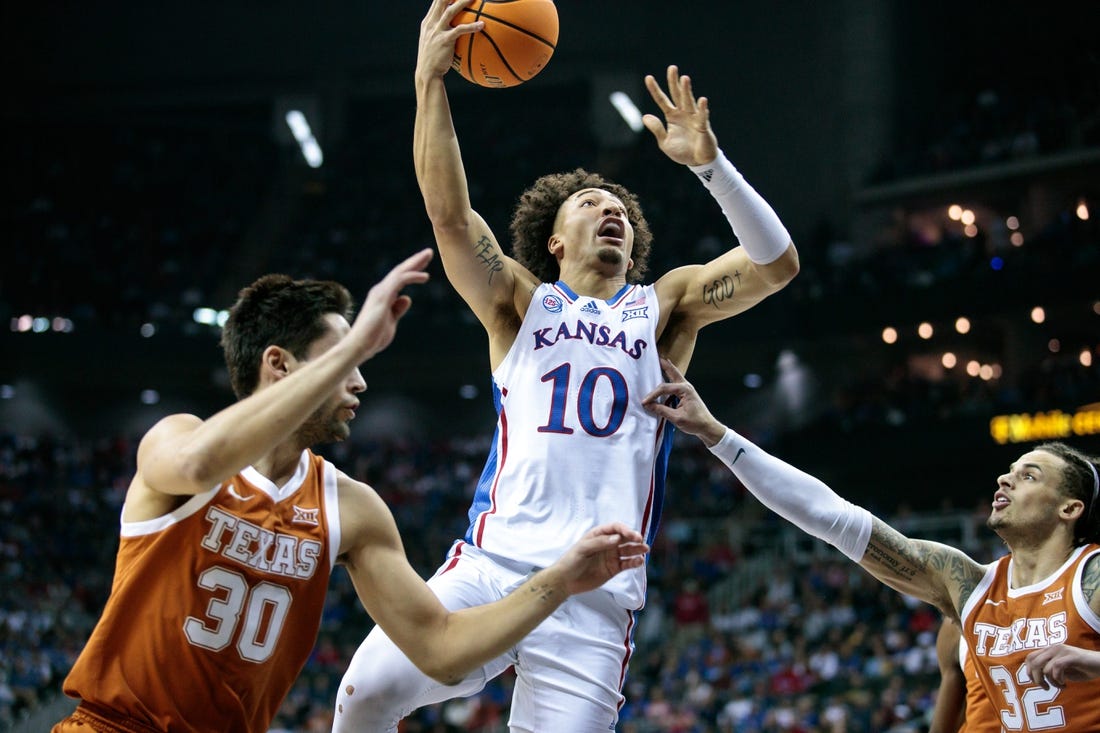 Mar 11, 2023; Kansas City, MO, USA; Kansas Jayhawks forward Jalen Wilson (10) puts up a shot during the first half against the Texas Longhorns at T-Mobile Center. Mandatory Credit: William Purnell-USA TODAY Sports