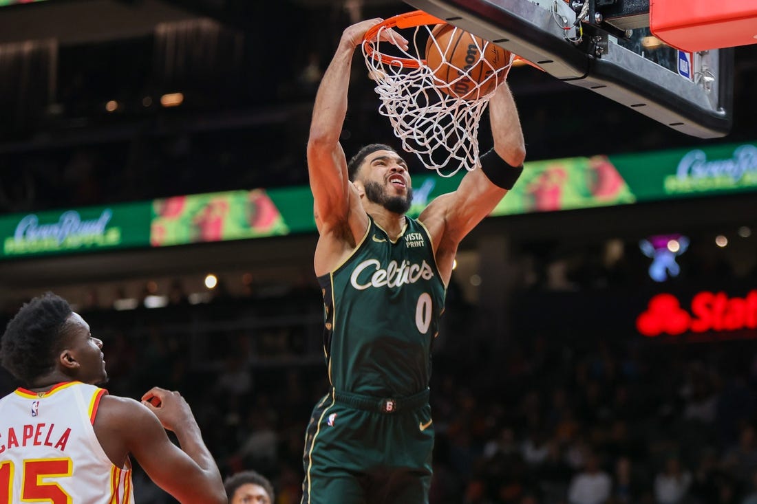 Mar 11, 2023; Atlanta, Georgia, USA; Boston Celtics forward Jayson Tatum (0) dunks against the Atlanta Hawks in the first quarter at State Farm Arena. Mandatory Credit: Brett Davis-USA TODAY Sports