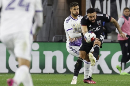 Mar 11, 2023; Washington, District of Columbia, USA; D.C. United defender Derrick Williams (3) clears the ball from Orlando City SC midfielder Mart n Ojeda (11) in the second half at Audi Field. Mandatory Credit: Geoff Burke-USA TODAY Sports