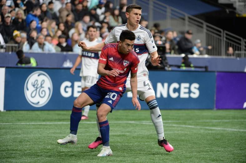 Mar 11, 2023; Vancouver, British Columbia, CAN; FC Dallas forward Alan Velasco (20) in action against Vancouver Whitecaps defender Ranko Veselinovic (4) at BC Place. Mandatory Credit: Anne-Marie Sorvin-USA TODAY Sports