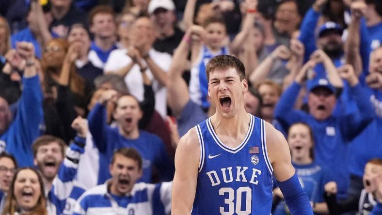 Mar 11, 2023; Greensboro, NC, USA;  Duke Blue Devils center Kyle Filipowski (30) reacts after scoring in the second half of the Championship game of the ACC Tournament at Greensboro Coliseum. Mandatory Credit: Bob Donnan-USA TODAY Sports